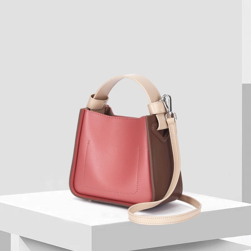 a handbag sitting on top of a white table 3