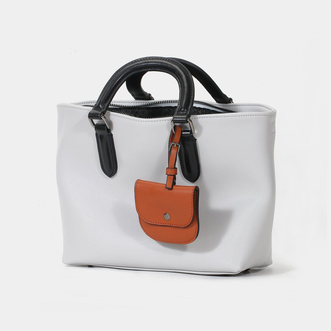 a white purse with a brown and black handle1